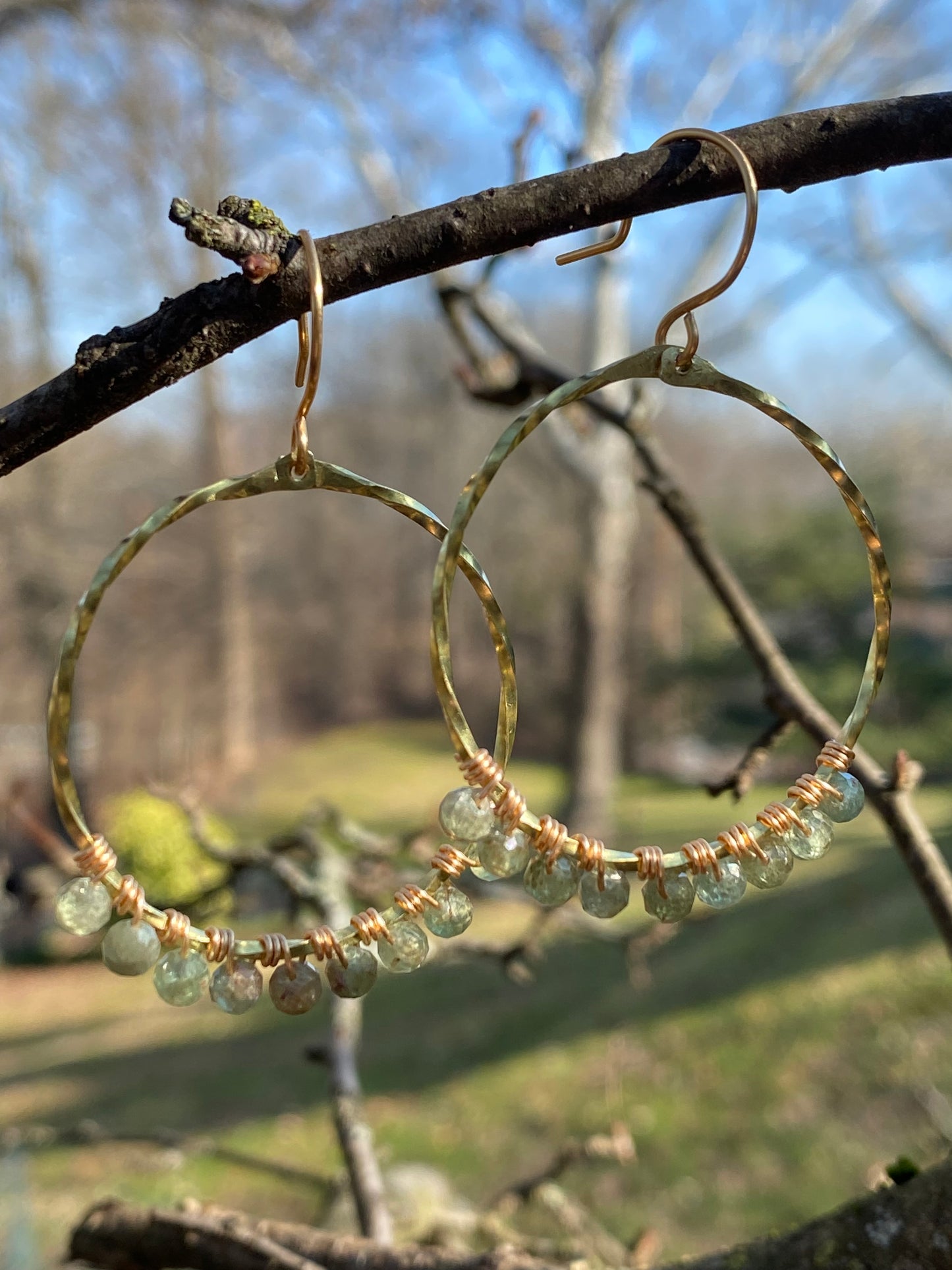 twisted brass hoops with green apatite