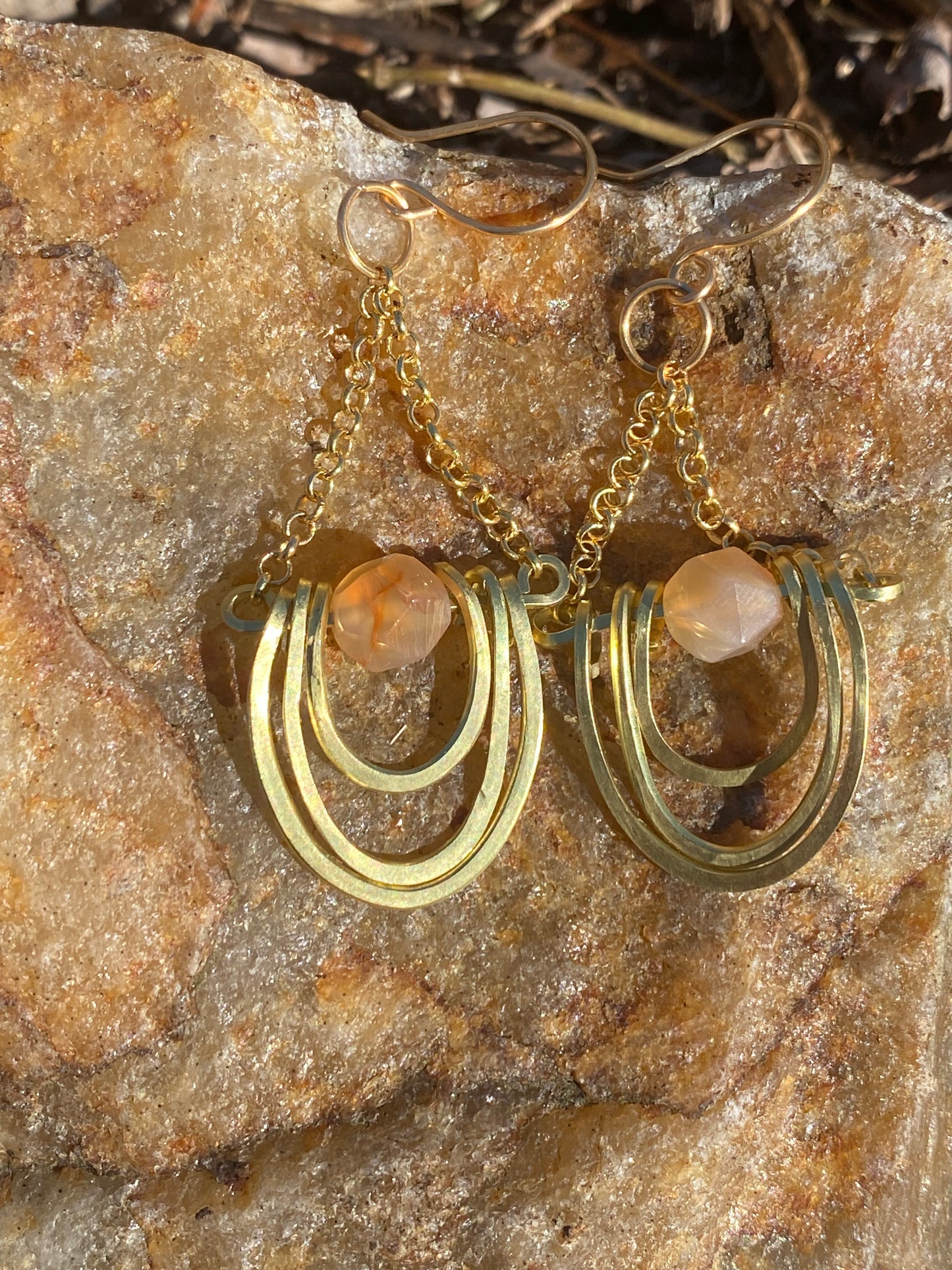 layered horseshoe and sunstone dangles