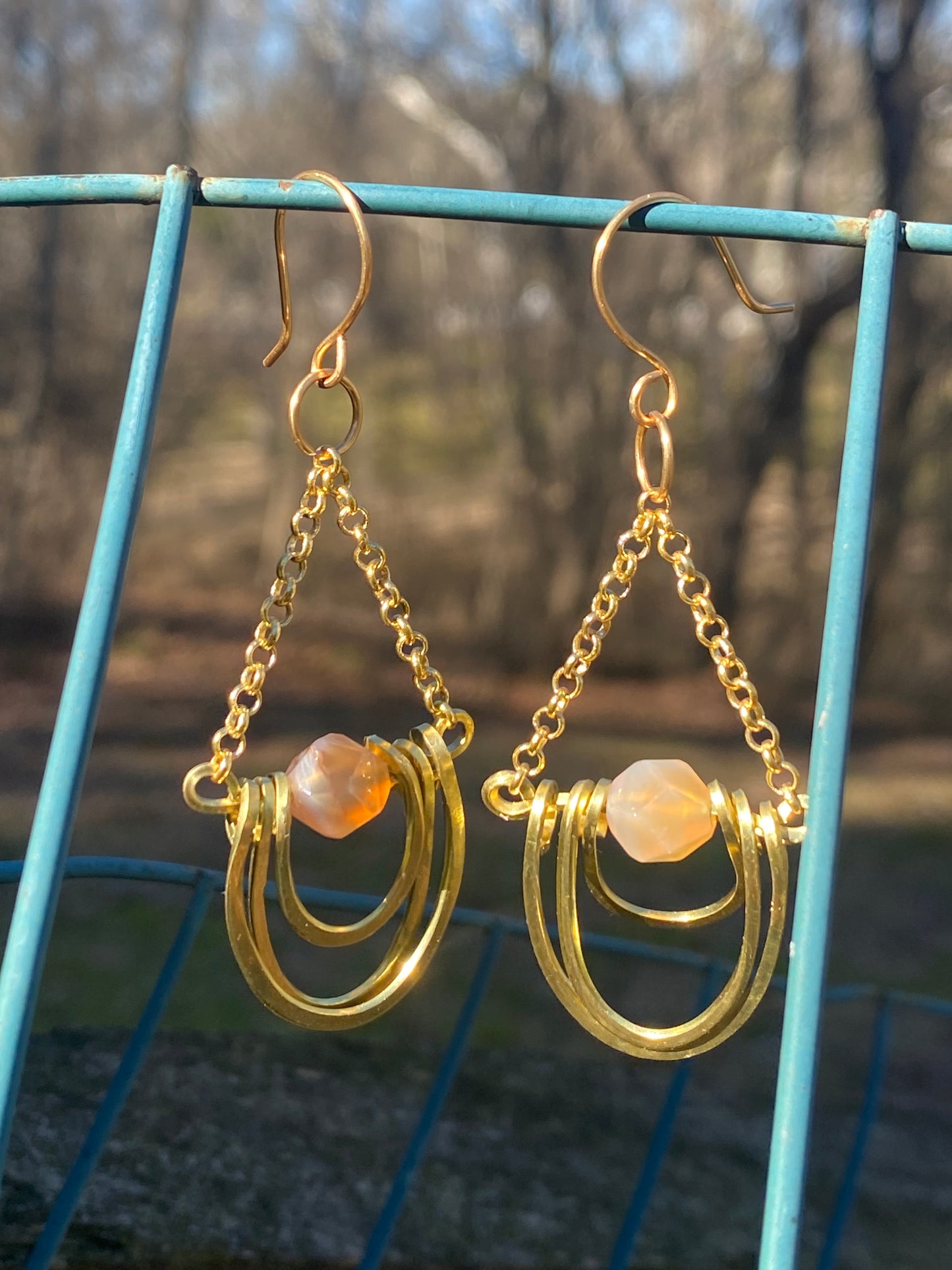 layered horseshoe and sunstone dangles