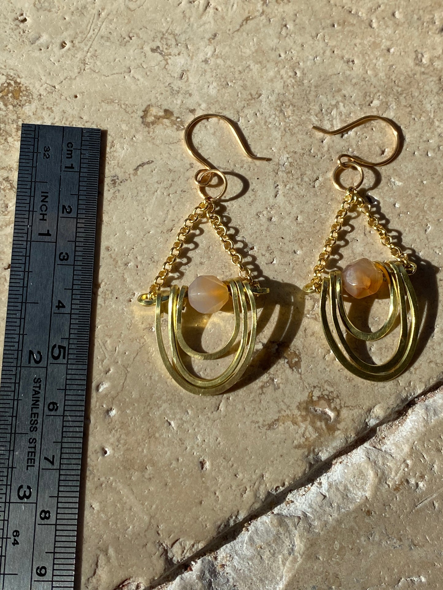 layered horseshoe and sunstone dangles