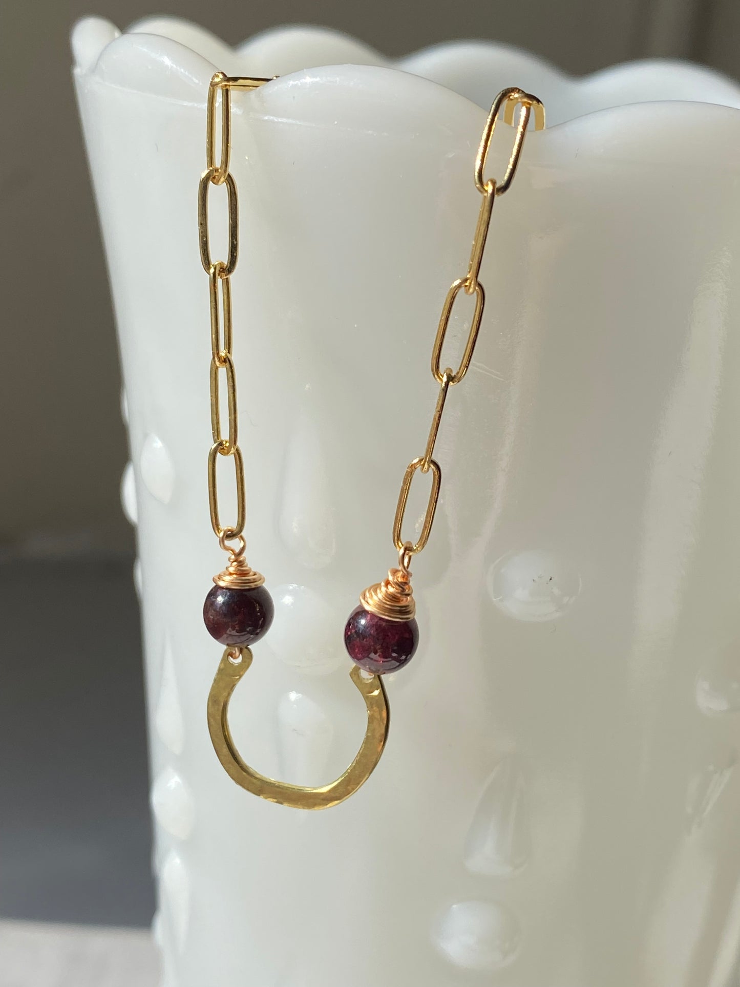 horseshoe and garnet bar necklace